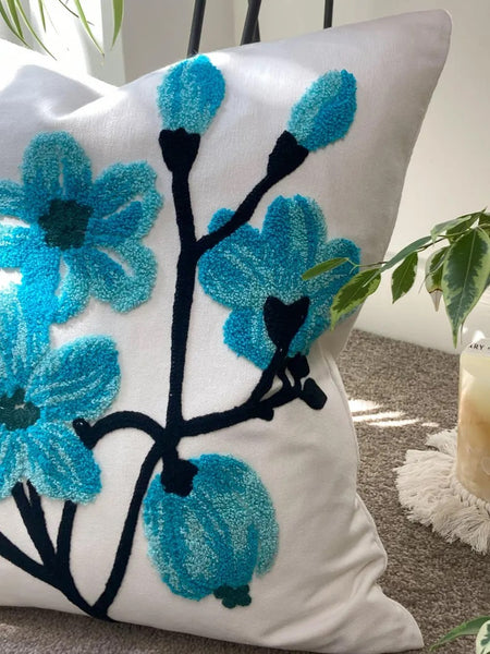 Funda cojín bordada flores turquesa