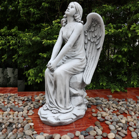 Angel con sentado
