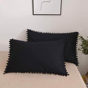 funda pompon rectangular negra