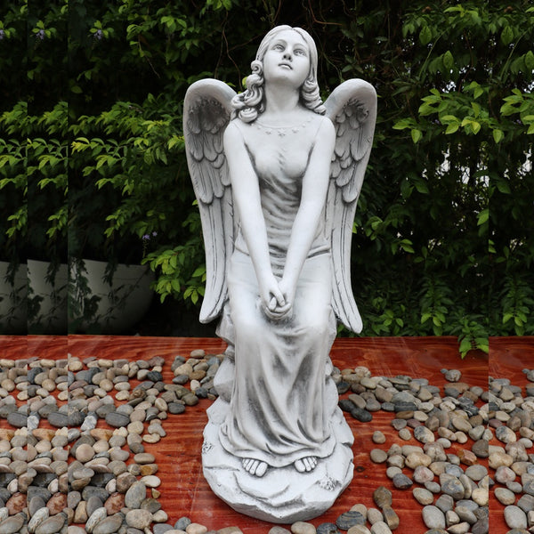 Angel con sentado