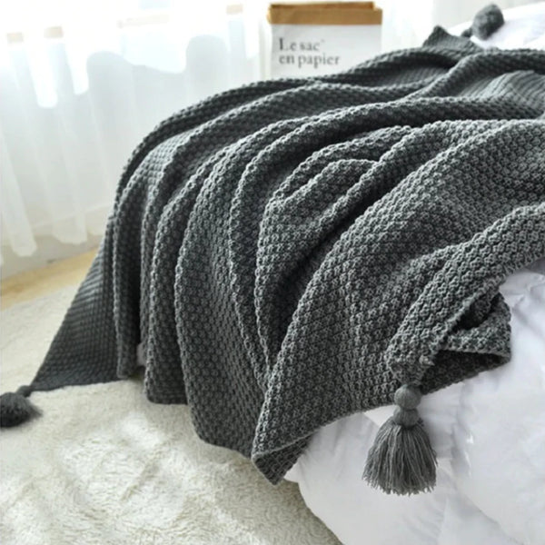 Manta con borlas y pompón Gris