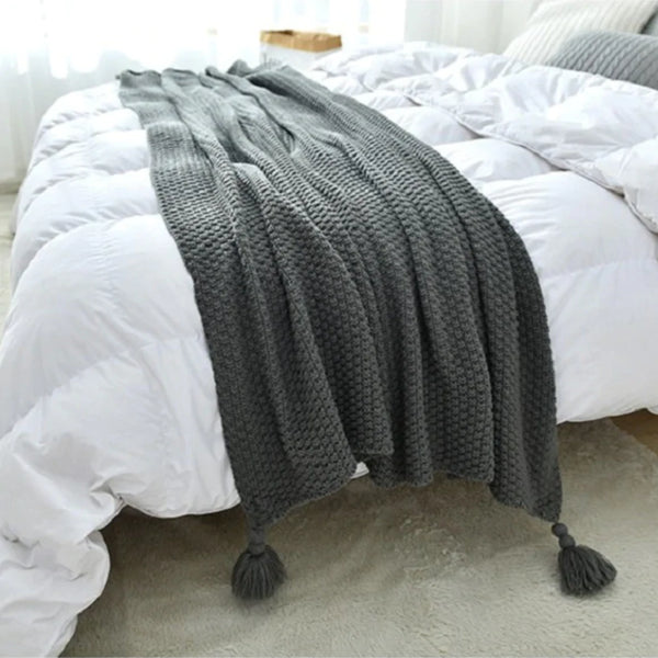 Manta con borlas y pompón Gris