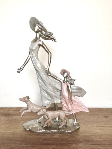 Figura mama hija perros